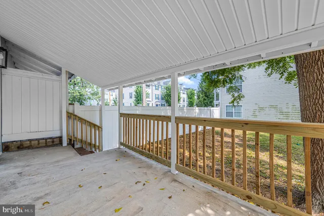 a view of a porch with wooden floor