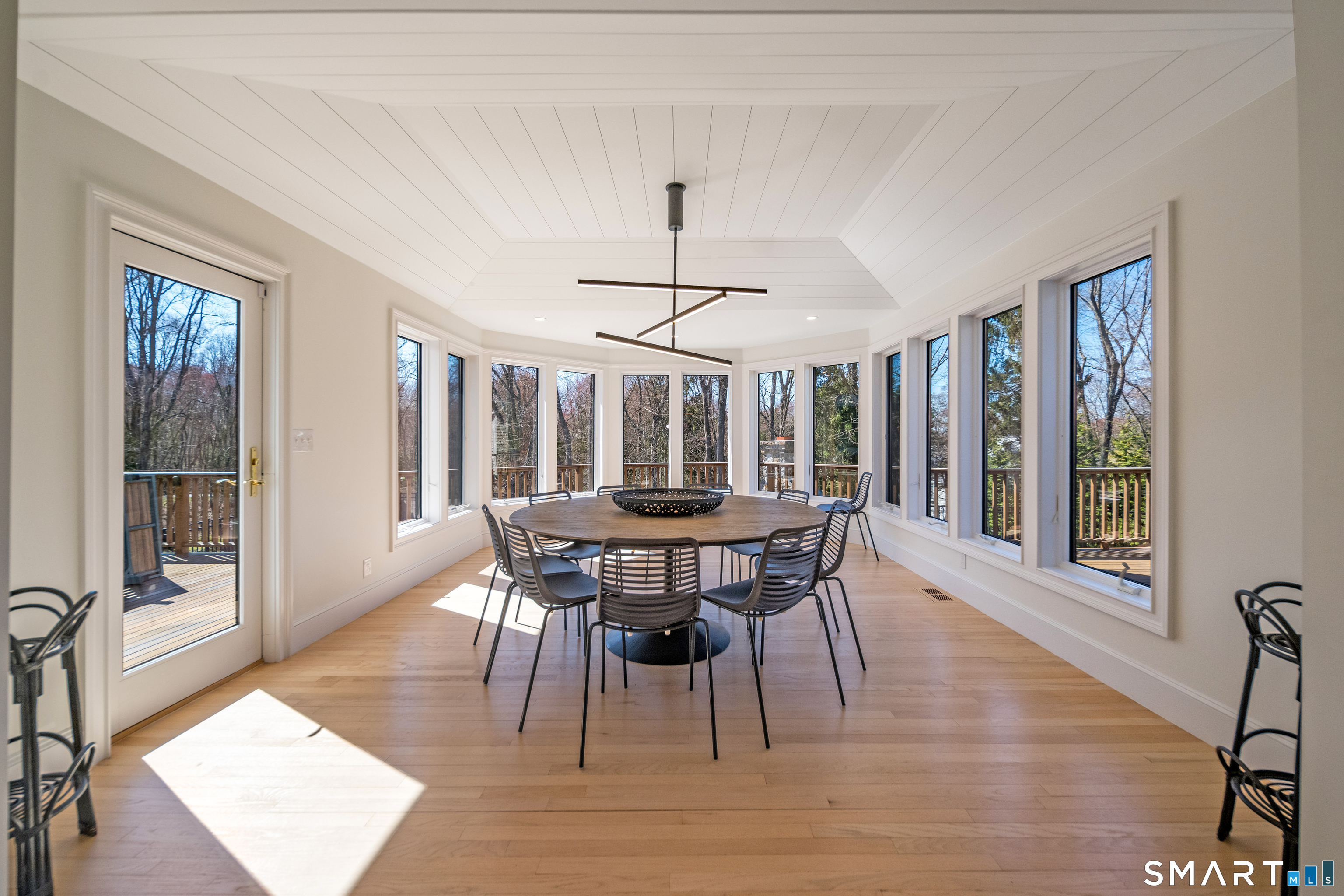 45 Island Avenue Madison, CT 06443 - Photo 11 of 38 a view of a dining room with furniture window and wooden floor