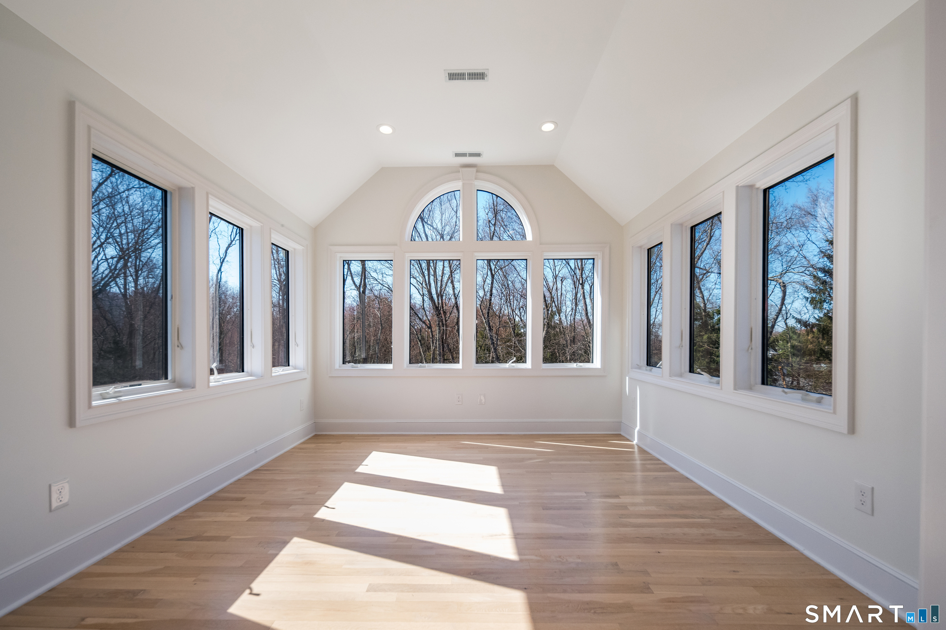 45 Island Avenue Madison, CT 06443 - Photo 17 of 38 a view of an entryway with wooden floor and door