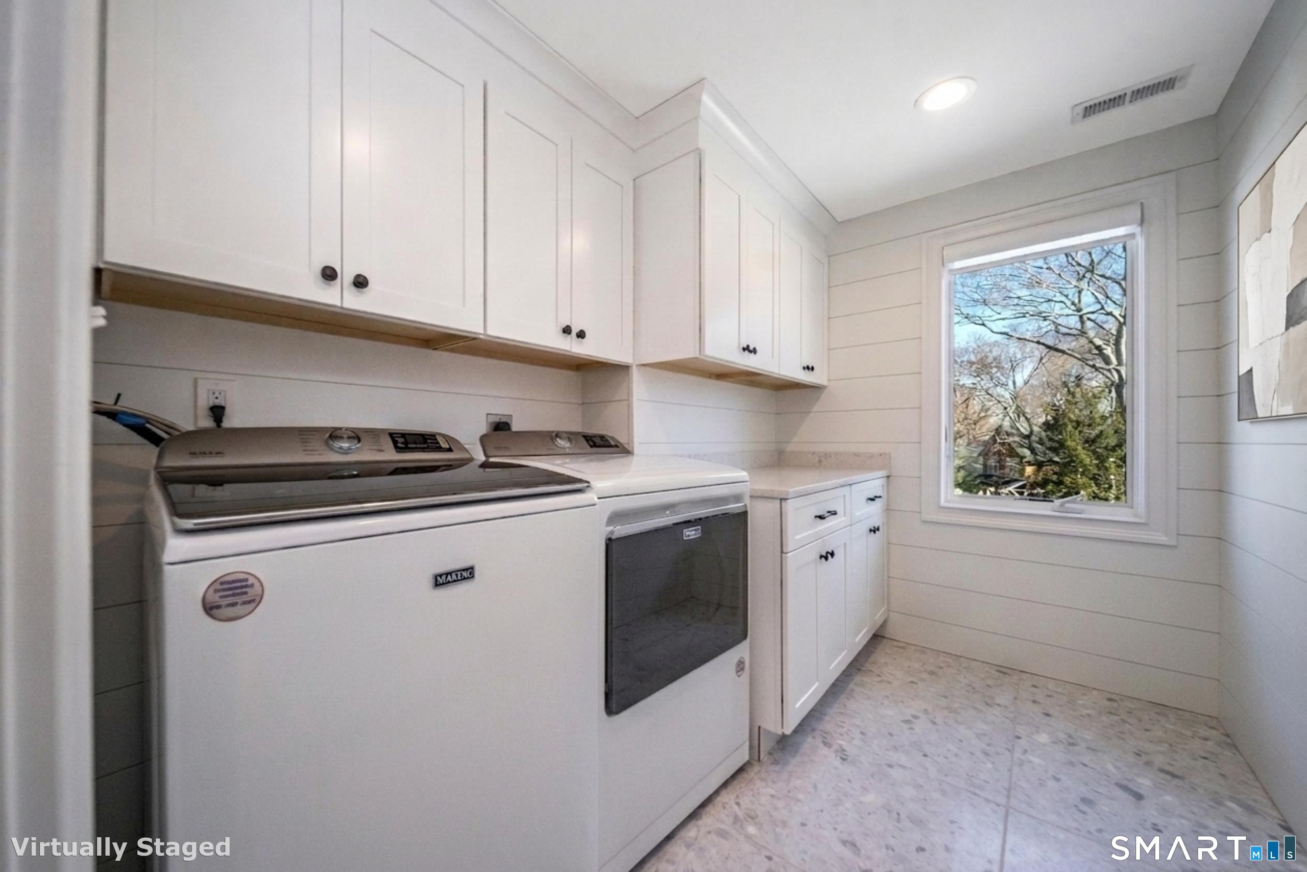 45 Island Avenue Madison, CT 06443 - Photo 22 of 38 a kitchen with granite countertop white cabinets and white appliances