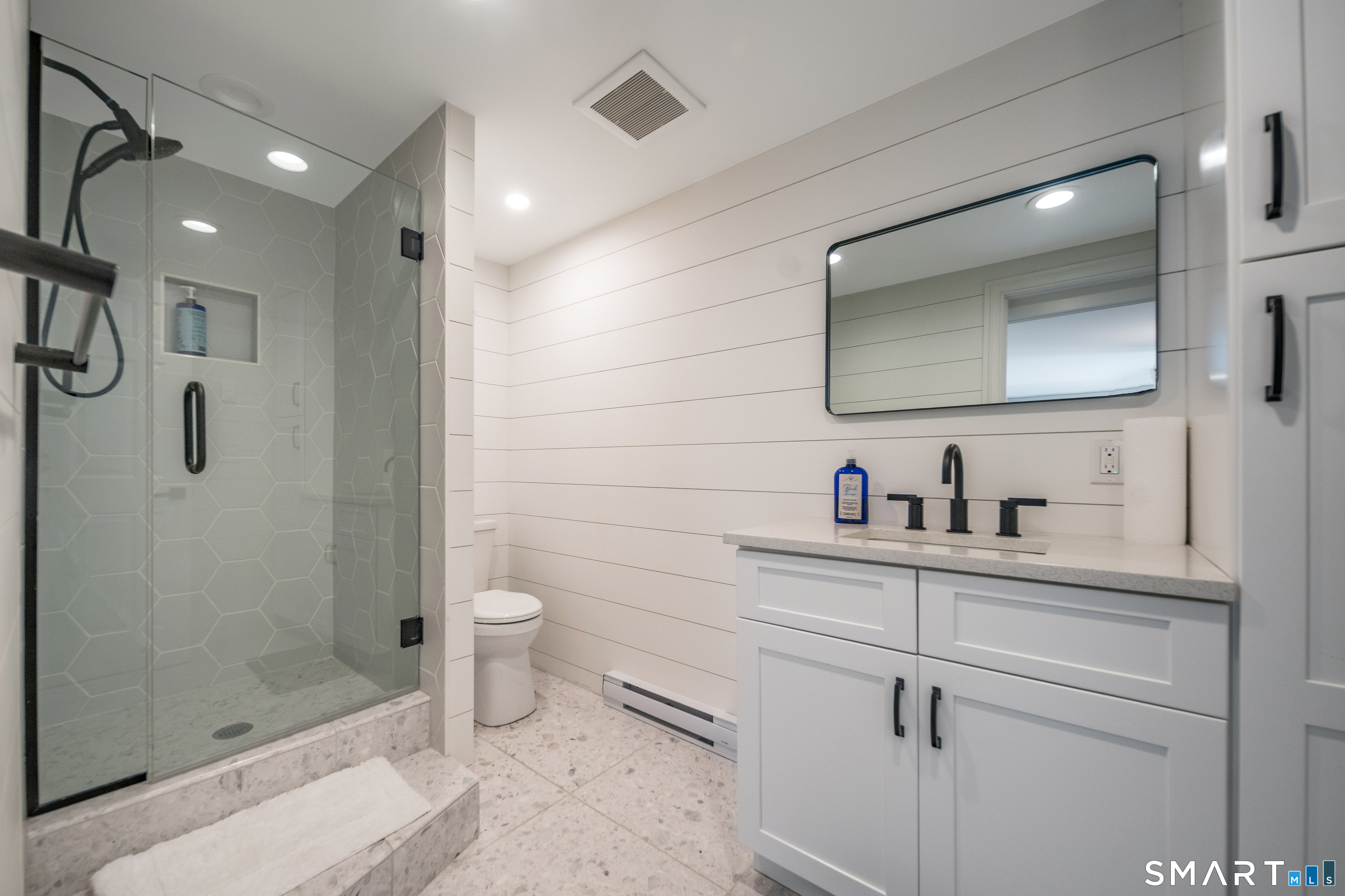 45 Island Avenue Madison, CT 06443 - Photo 30 of 38 a bathroom with a toilet sink and shower