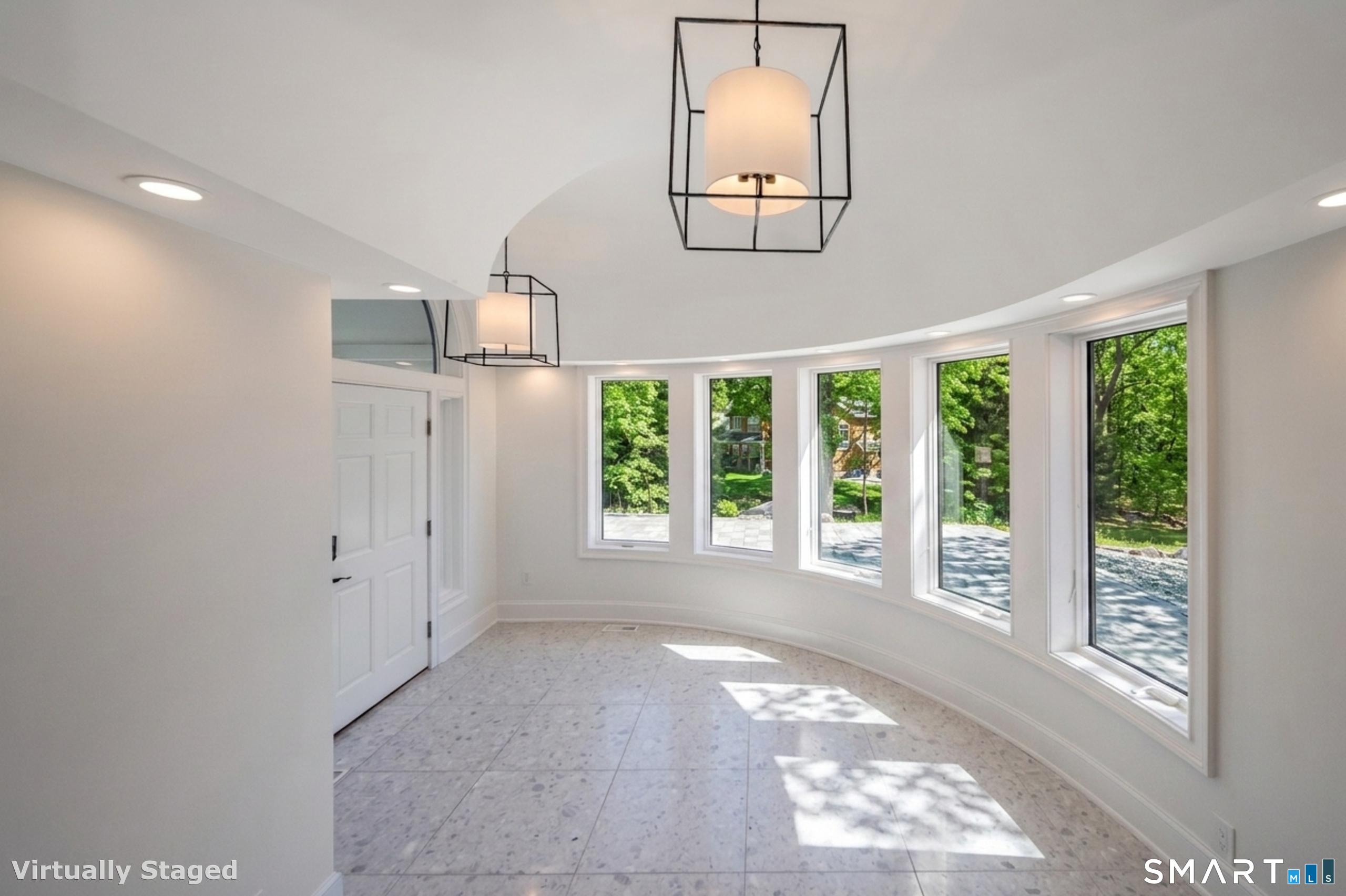 45 Island Avenue Madison, CT 06443 - Photo 4 of 38 a view of a big room with windows and entryway