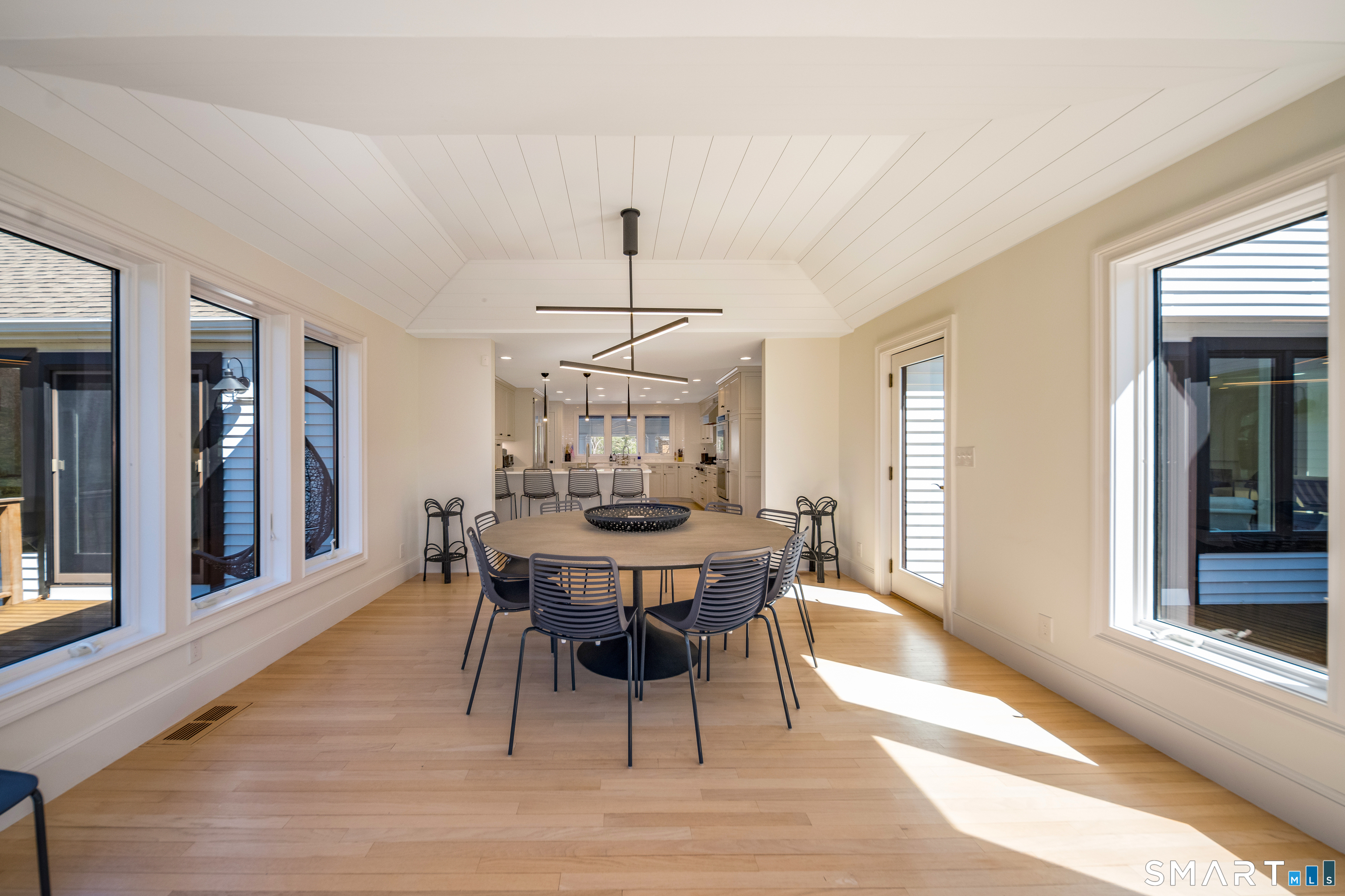 45 Island Avenue Madison, CT 06443 - Photo 8 of 38 a view of a dining room with furniture window and wooden floor