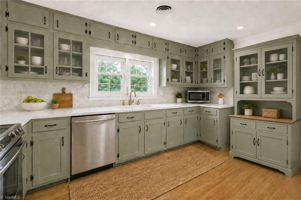 626 Kenneth Road Greensboro, NC 27455 - Photo 7 of 34 Digitally enhanced with same cabiinetry. Huge kitchen with room for breakfast table