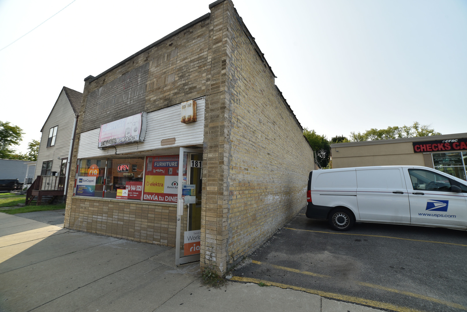 1809 Washington Street Waukegan, IL 60085 - Photo 3 of 16 a view of a car park in front of house
