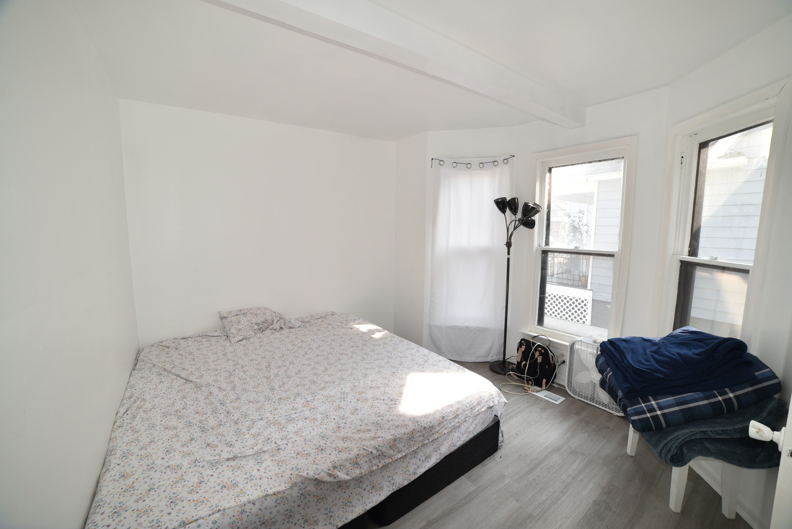 1809 Washington Street Waukegan, IL 60085 - Photo 7 of 16 a bedroom with a bed and wooden floor