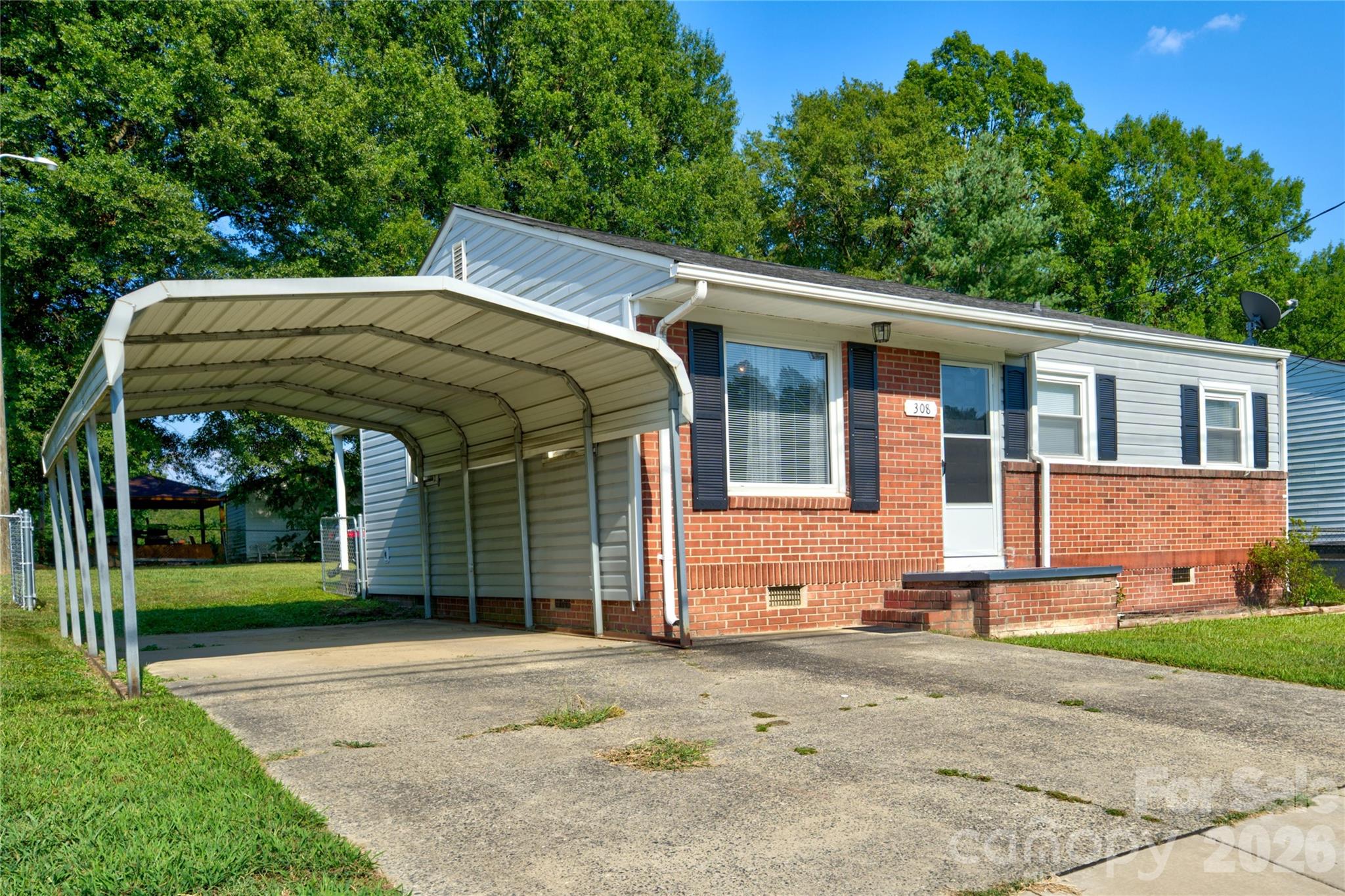 308 South Myrtle School Road Gastonia, NC 28052 - Photo 2 of 22 a front view of a house with garden