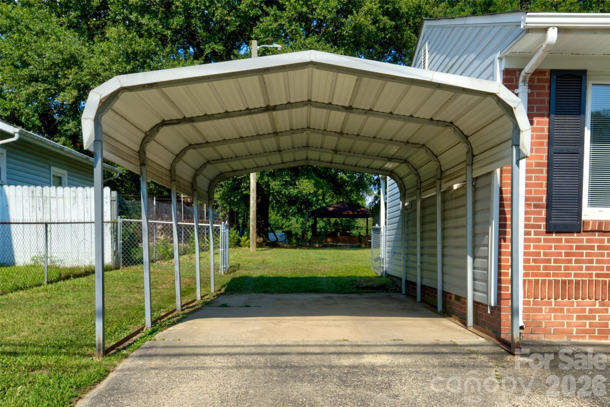 308 South Myrtle School Road Gastonia, NC 28052 - Photo 3 of 22 a view of a wooden door with a yard