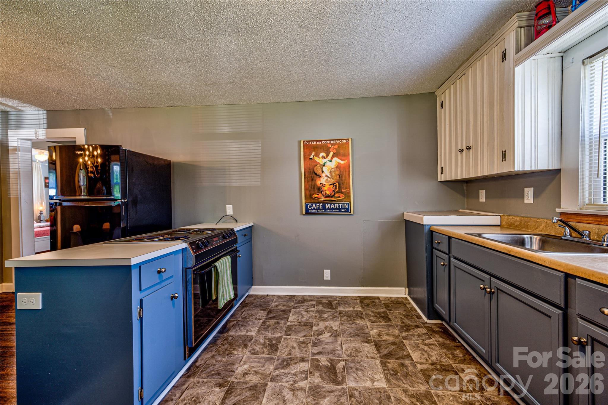 308 South Myrtle School Road Gastonia, NC 28052 - Photo 9 of 22 a kitchen with a stove and a sink