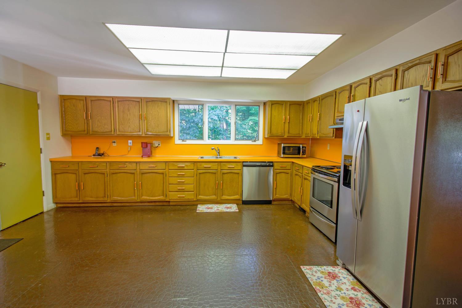 151 Clarks Road Rustburg, VA 24588 - Photo 13 of 81 a kitchen with stainless steel appliances a refrigerator sink and cabinets