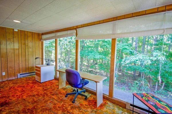 a spacious bedroom with a bed and window
