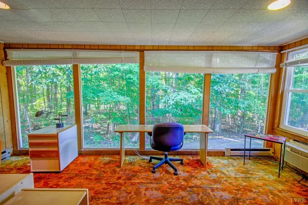 a spacious bathroom with a tub sink and mirror