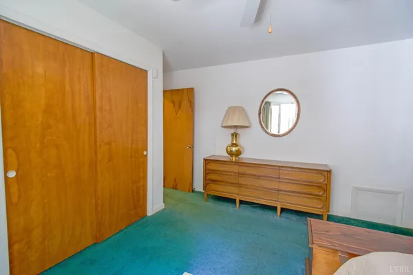 a view of an entryway with wooden floor and door