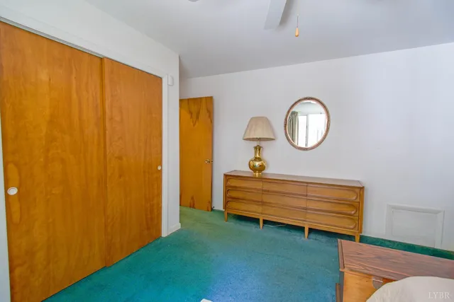 a view of an entryway with wooden floor and door