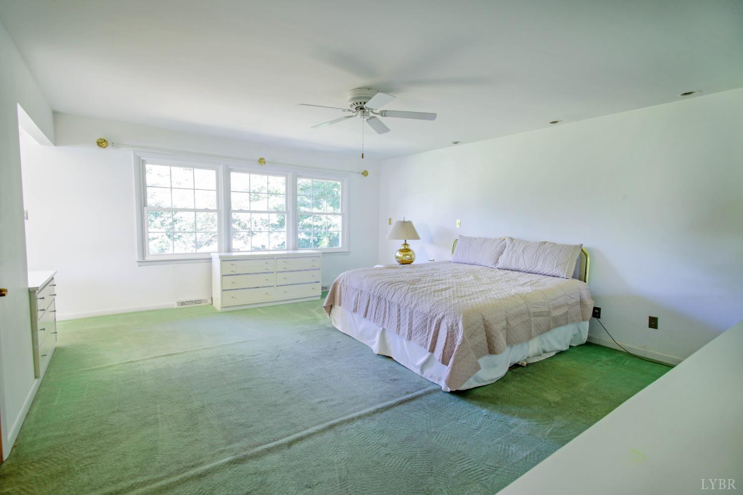 151 Clarks Road Rustburg, VA 24588 - Photo 38 of 81 a spacious bedroom with a bed and window