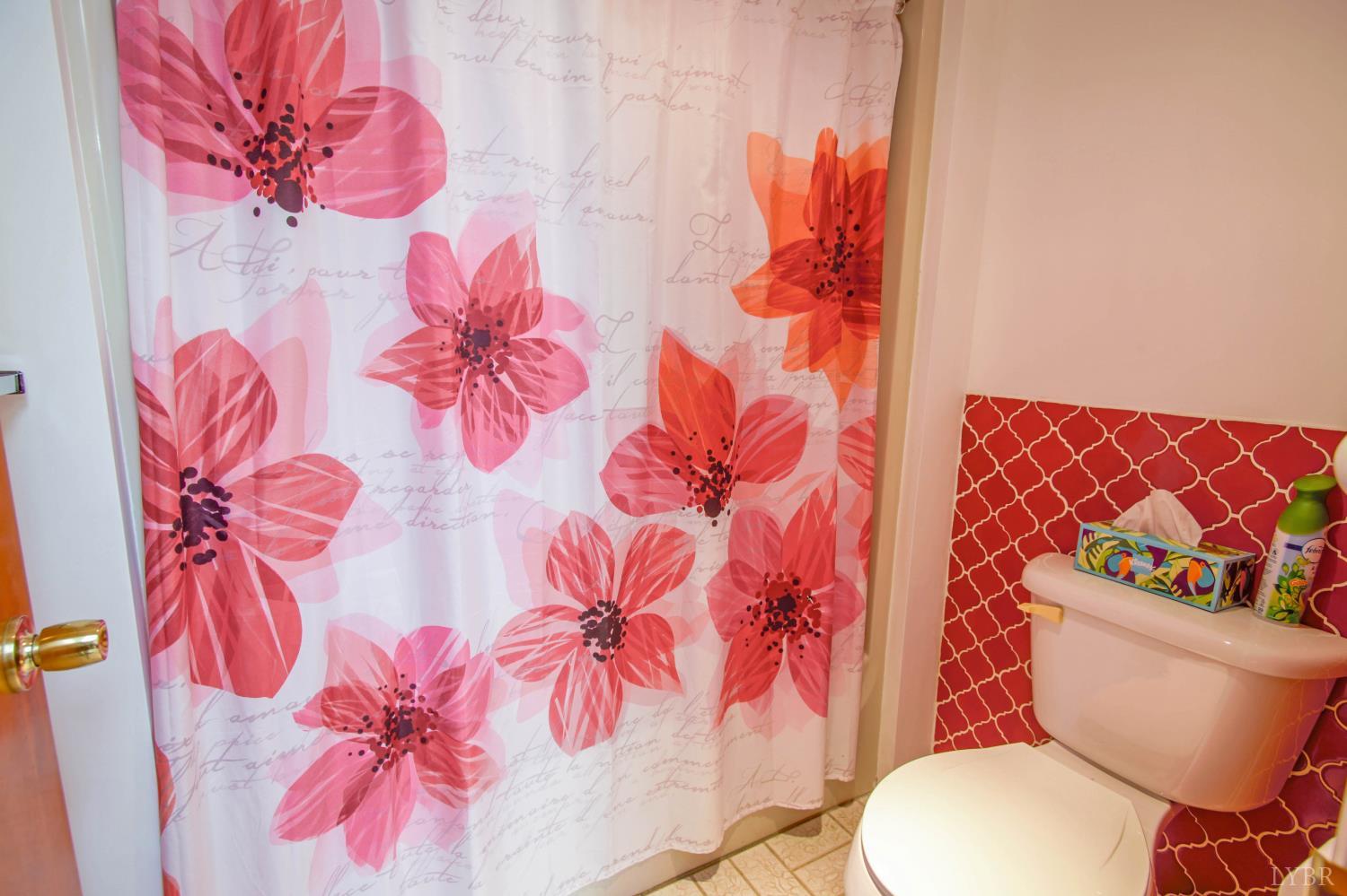 151 Clarks Road Rustburg, VA 24588 - Photo 44 of 81 a white toilet sitting next to a shower curtain