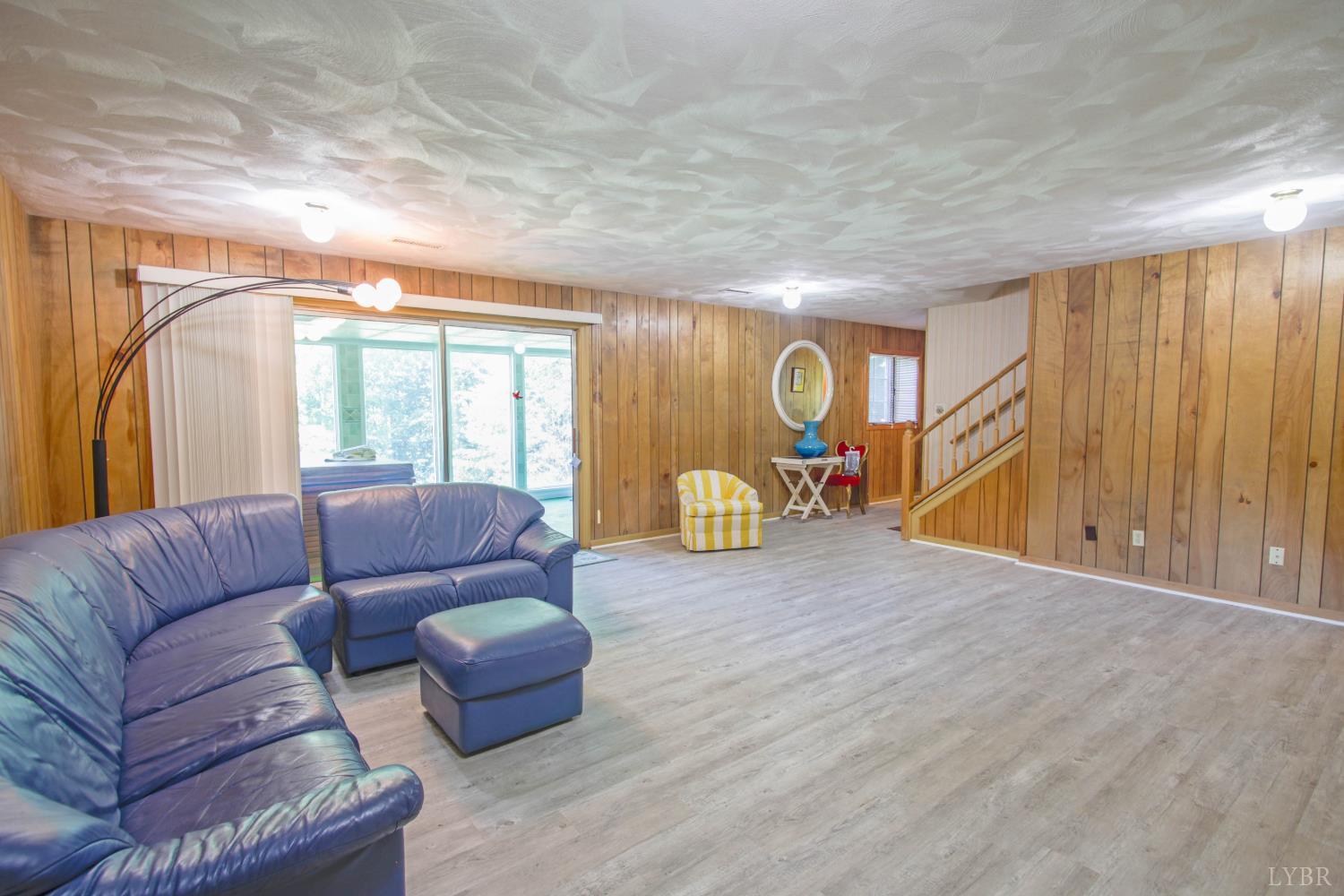 151 Clarks Road Rustburg, VA 24588 - Photo 50 of 81 a living room with furniture and a rug