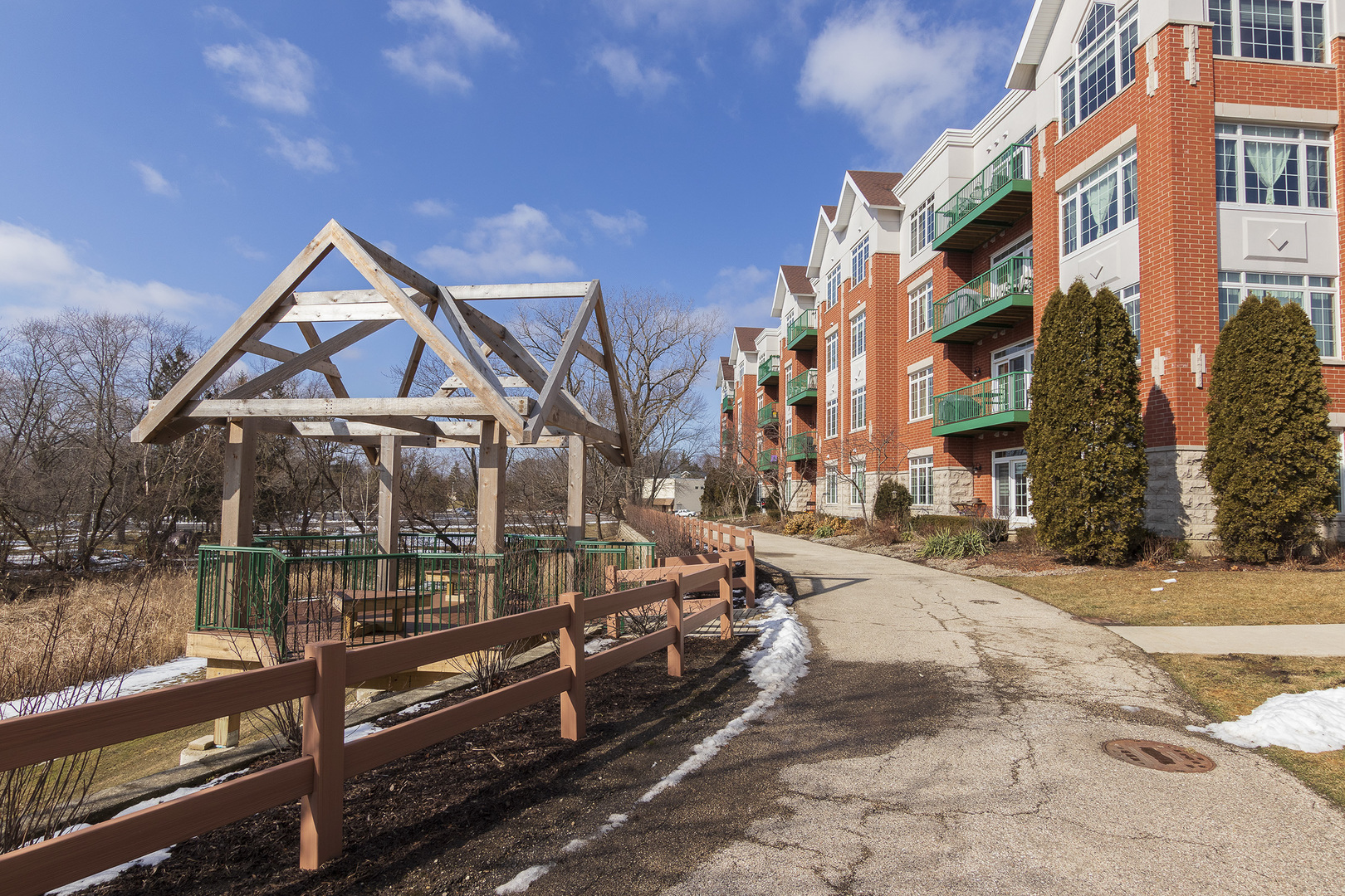 640 McHenry Road, Unit 301 Wheeling, IL 60090 - Photo 4 of 9 a view of a street with houses