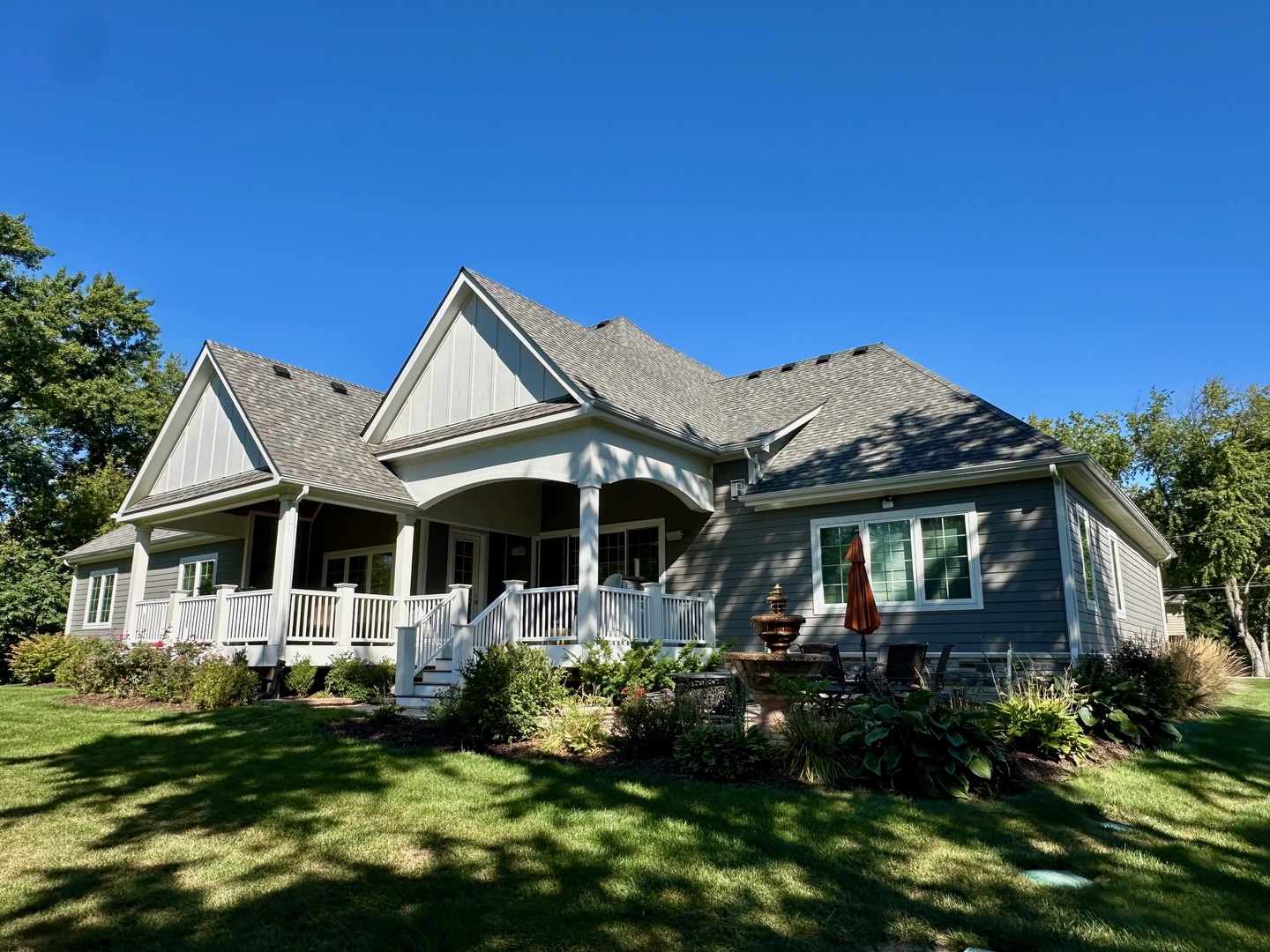 26303 West Merton Road Barrington, IL 60010 - Photo 2 of 5 a front view of a house with a garden