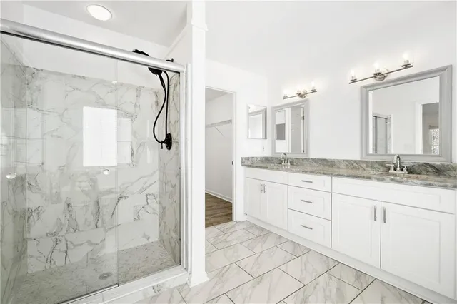 a view of empty room with wooden floor and window