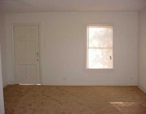 2913 Waldron Road Corpus Christi, TX 78418 - Photo 2 of 8 an empty room with a window