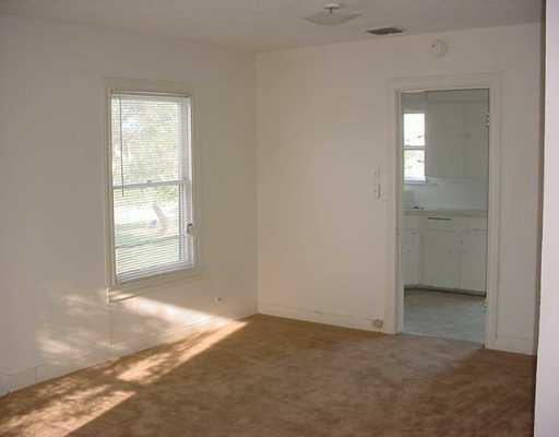 2913 Waldron Road Corpus Christi, TX 78418 - Photo 3 of 8 an empty room with windows and closet