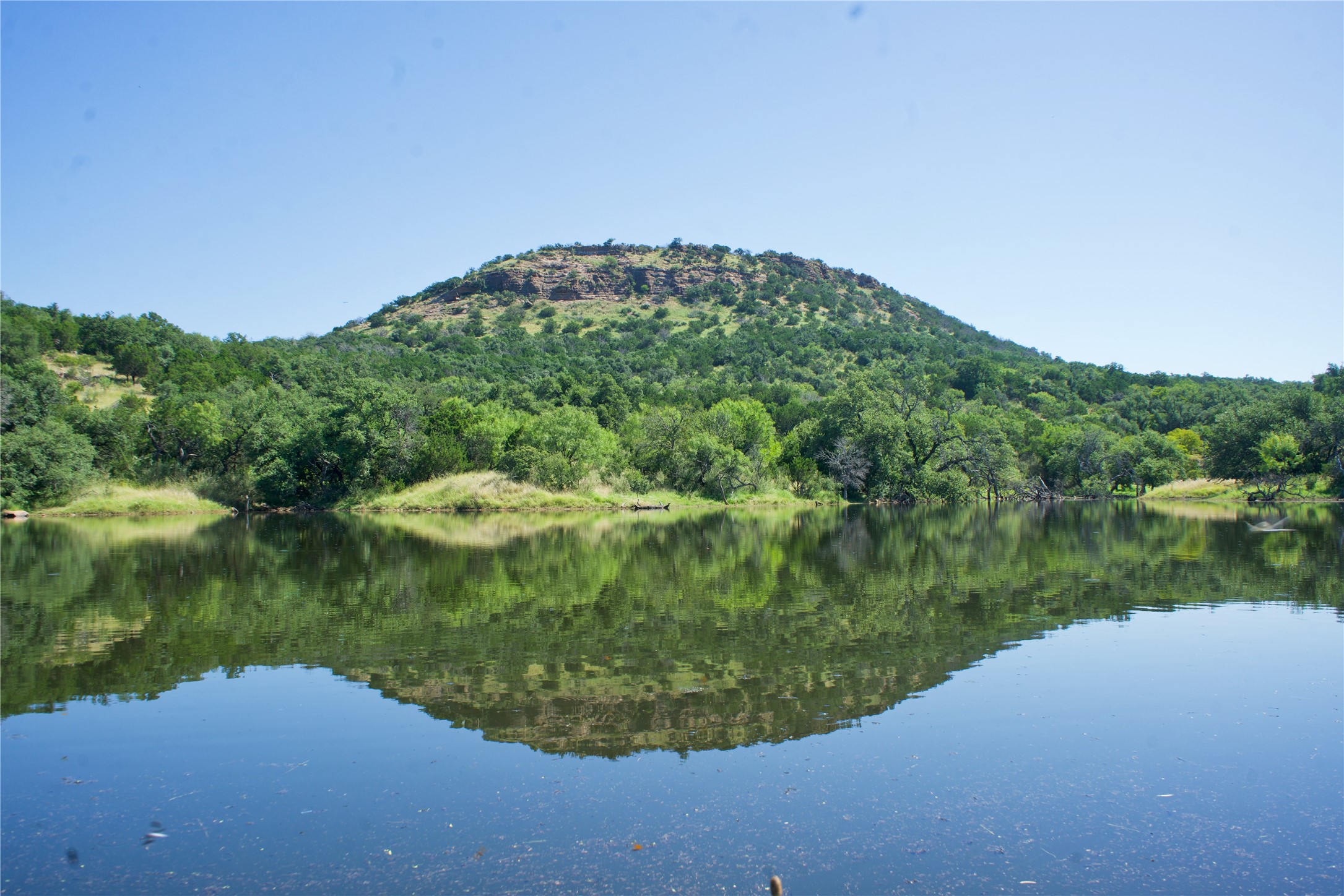 a view of a lake from a balcony