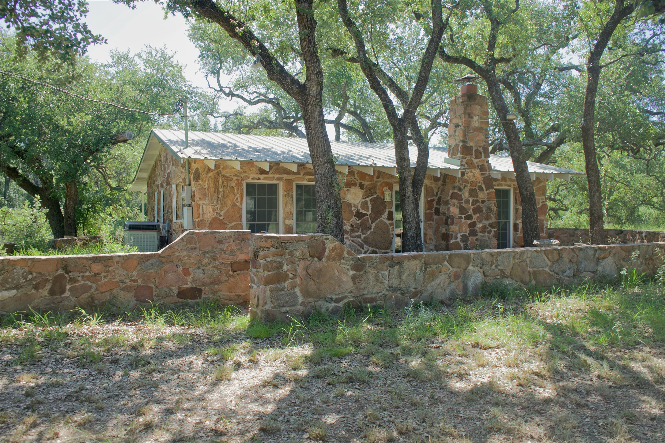 585 Hickory Spring Road Willow City, TX 78675 - Photo 14 of 25 a view of a house with a yard