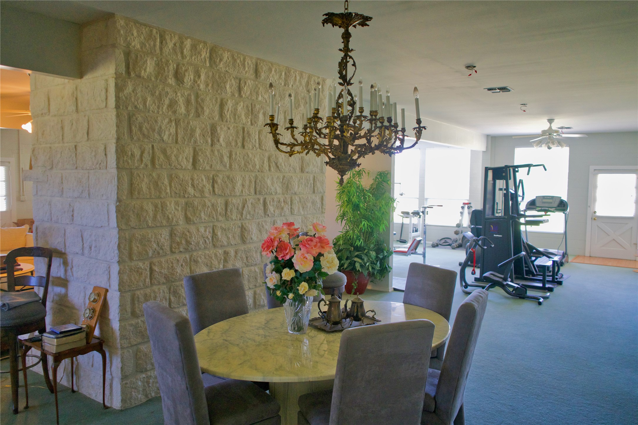 585 Hickory Spring Road Willow City, TX 78675 - Photo 18 of 25 a view of a dining room with furniture and a chandelier