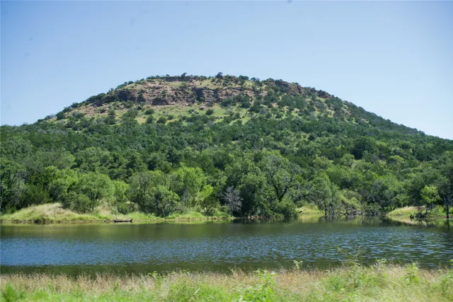 a view of a lake with a yard