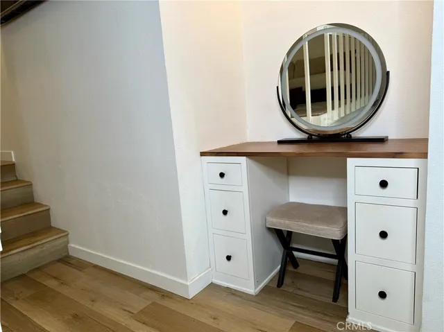 a living room with a couch and a rug