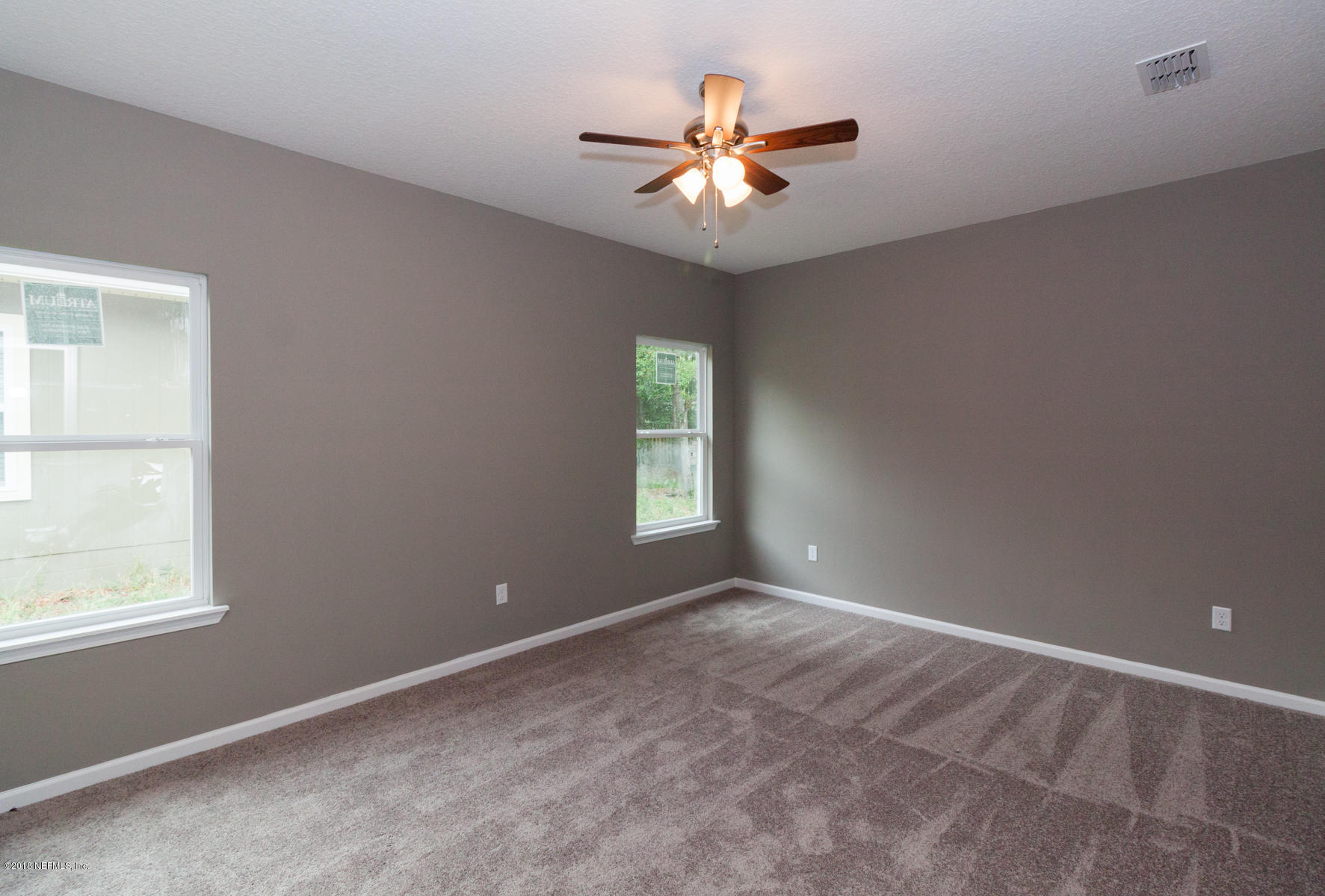 12879 Beaubien Road Jacksonville, FL 32258 - Photo 17 of 28 a view of an empty room with a window