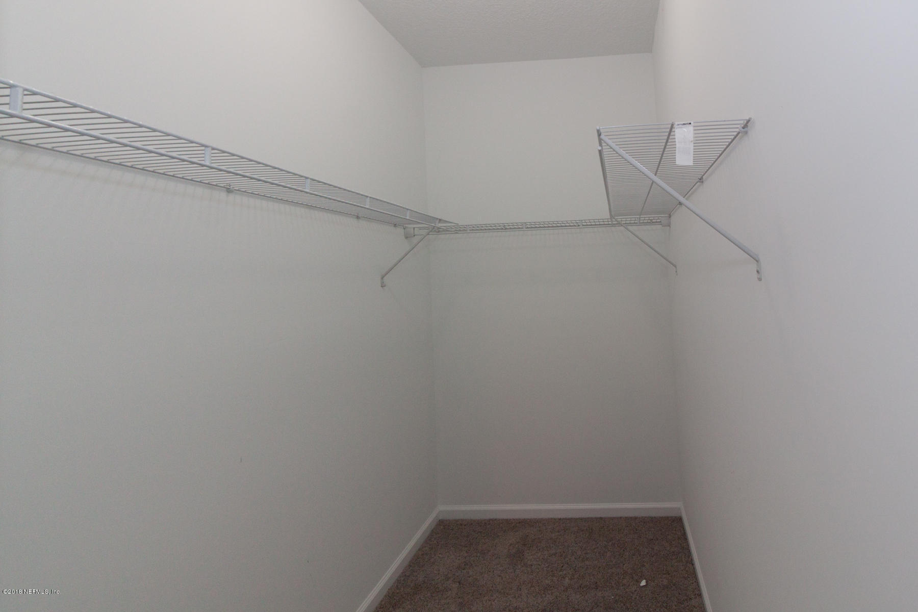 12879 Beaubien Road Jacksonville, FL 32258 - Photo 18 of 28 a view of small space with racks on the wall