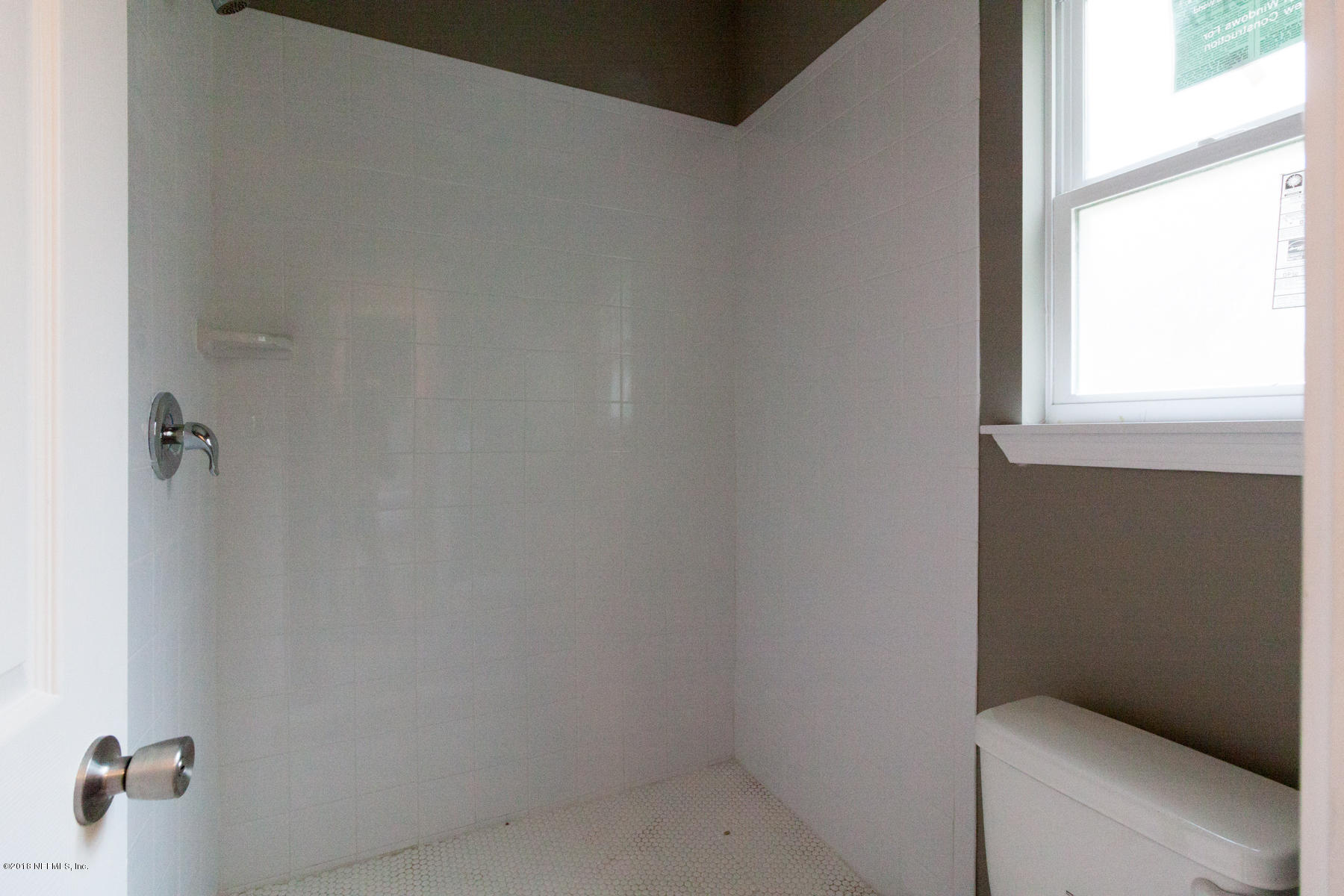 12879 Beaubien Road Jacksonville, FL 32258 - Photo 20 of 28 a bathroom with a window