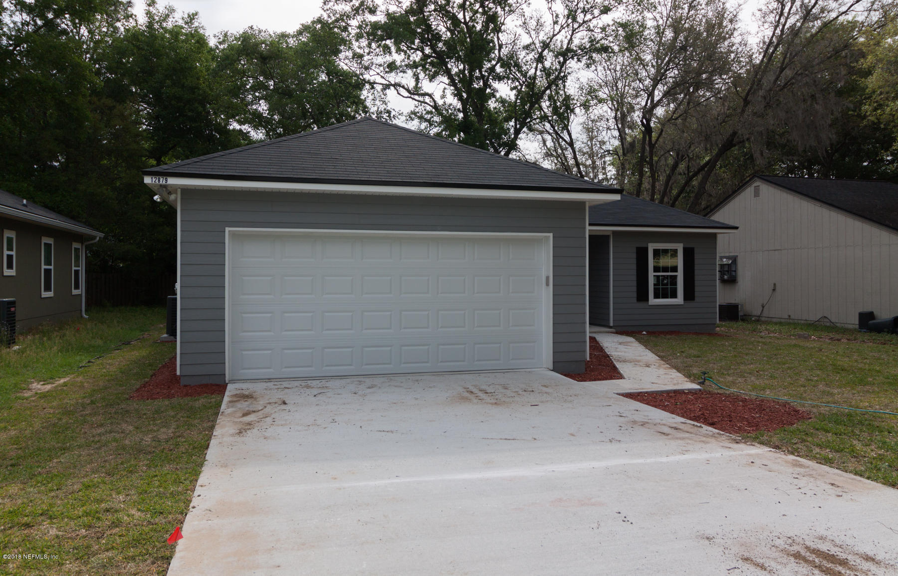12879 Beaubien Road Jacksonville, FL 32258 - Photo 2 of 28 a front view of a house with a yard