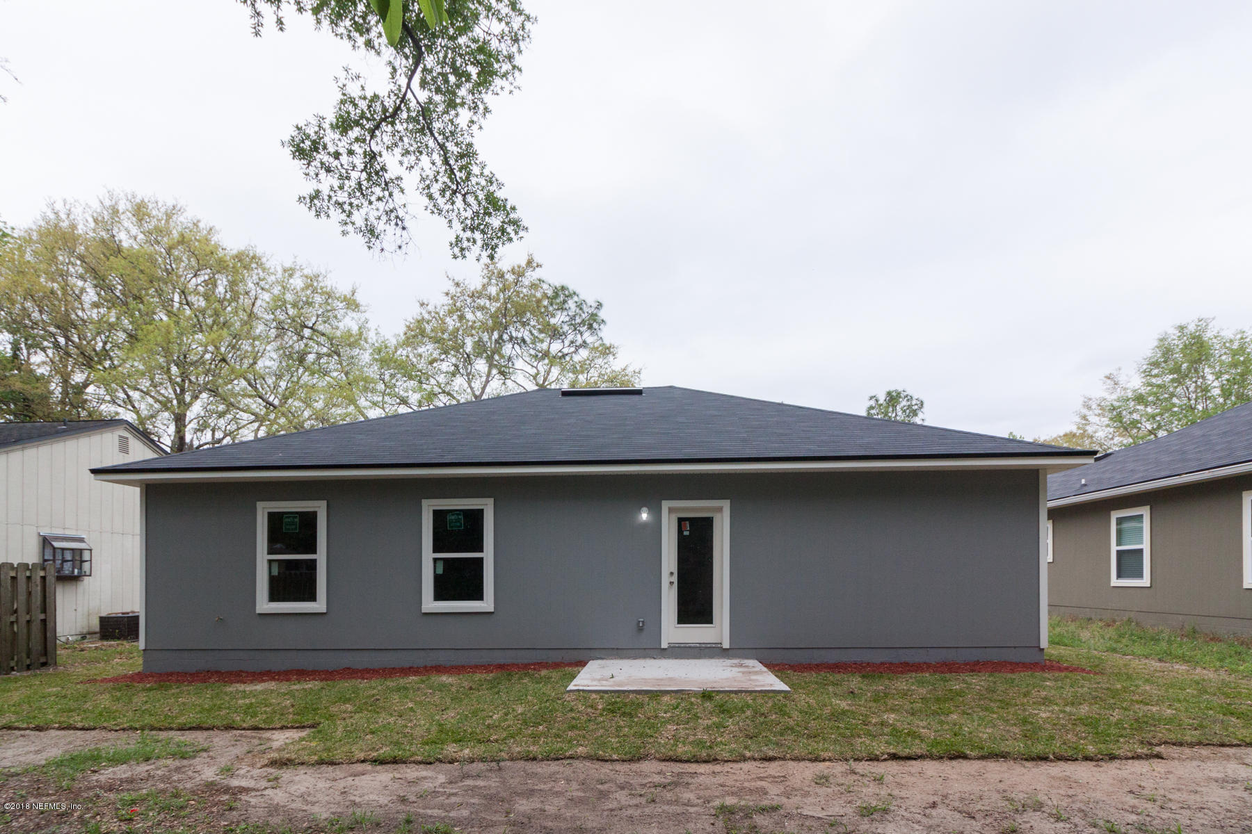 12879 Beaubien Road Jacksonville, FL 32258 - Photo 27 of 28 a front view of a house with a yard and garage