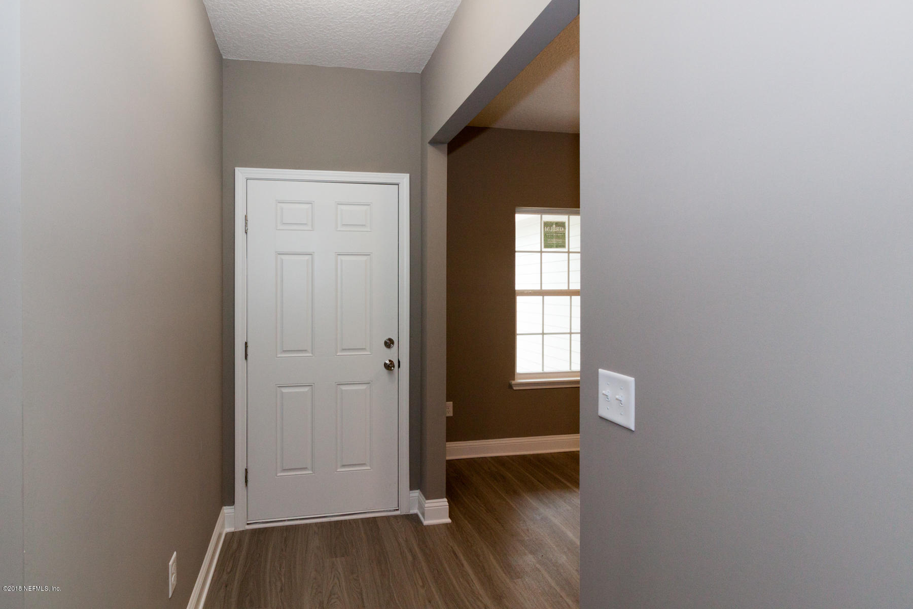 12879 Beaubien Road Jacksonville, FL 32258 - Photo 5 of 28 a view of hallway with window and wooden floor