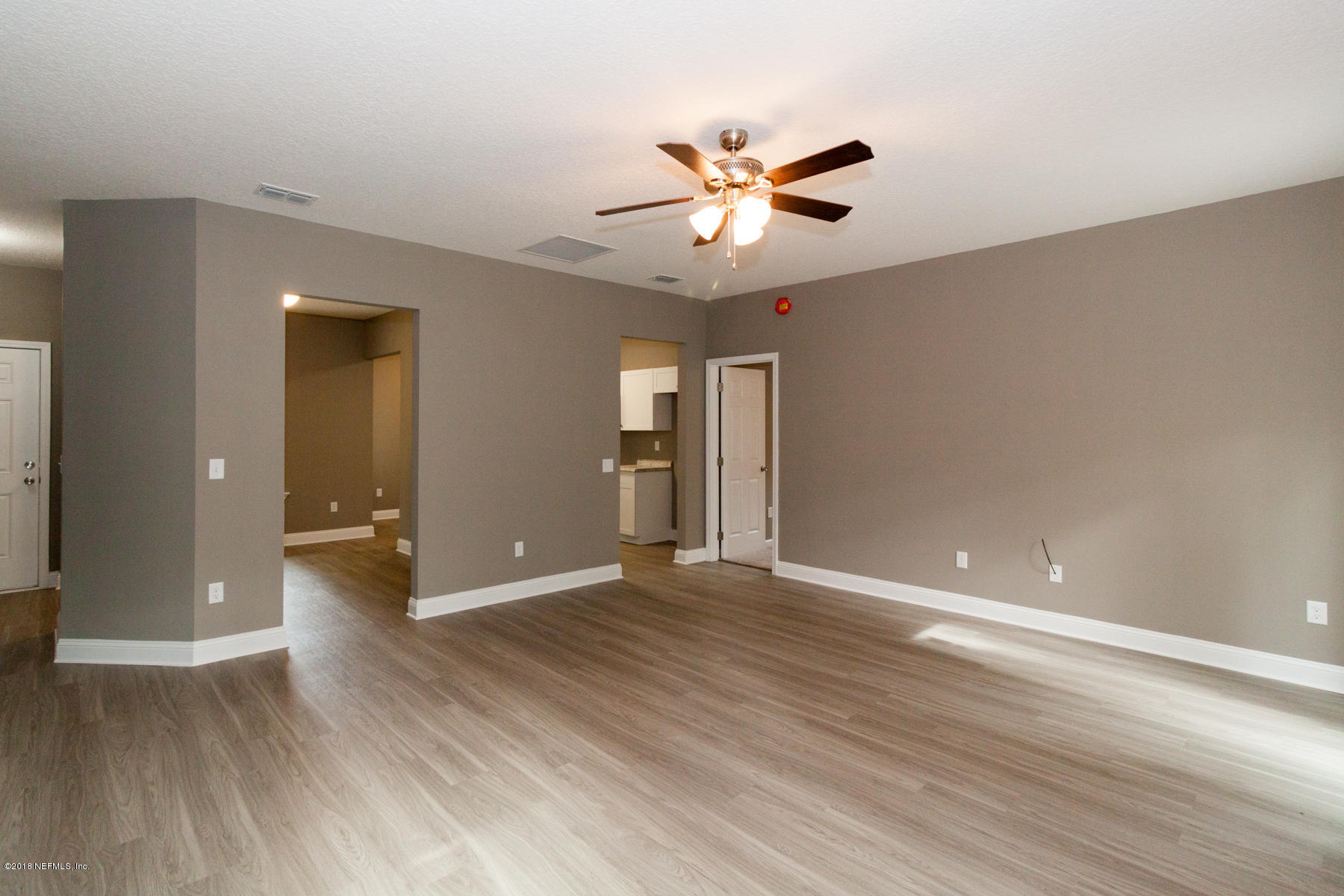 12879 Beaubien Road Jacksonville, FL 32258 - Photo 9 of 28 a view of empty room with wooden floor