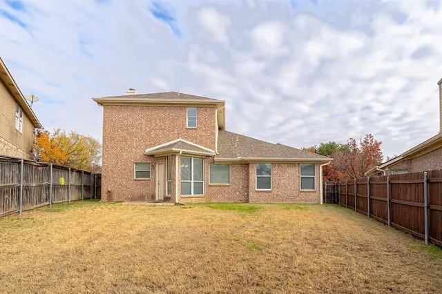 a front view of a house with fence