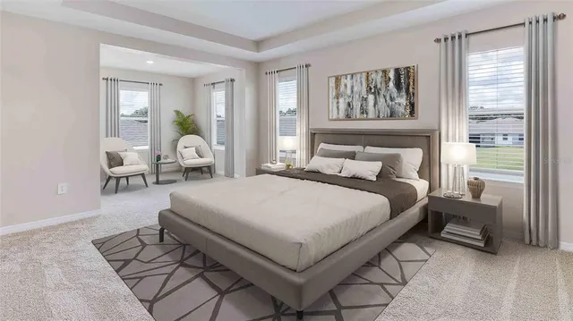 a bedroom with a large bed and a window