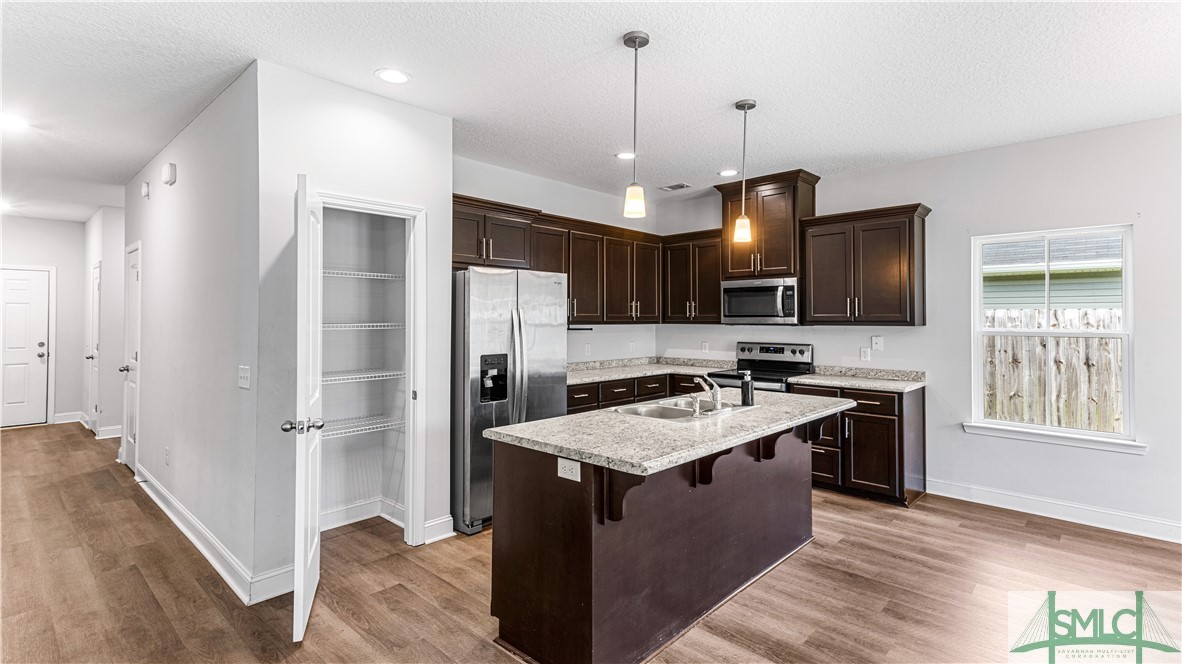 436 Talmadge Road Allenhurst, GA 31301 - Photo 11 of 30 Pantry and large kitchen island