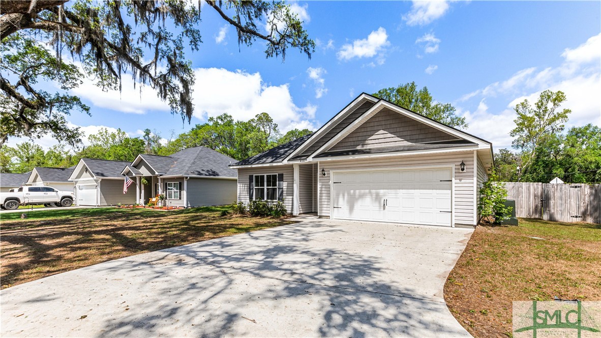 436 Talmadge Road Allenhurst, GA 31301 - Photo 2 of 30 Mature trees and landscape out front