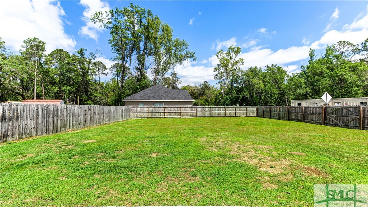 436 Talmadge Road Allenhurst, GA 31301 - Photo 5 of 30 Fully fenced back yard