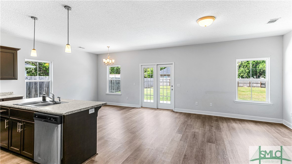 436 Talmadge Road Allenhurst, GA 31301 - Photo 6 of 30 Living, Dining, Kitchen with direct access to back