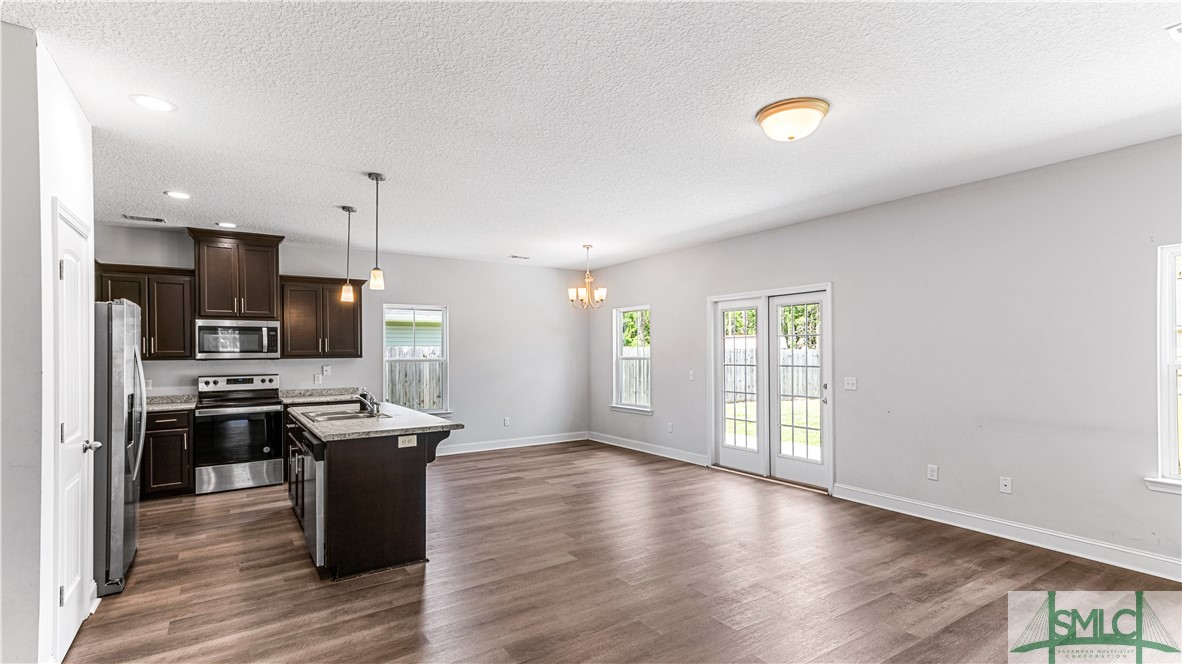 436 Talmadge Road Allenhurst, GA 31301 - Photo 7 of 30 Kitchen & dining room view from living room