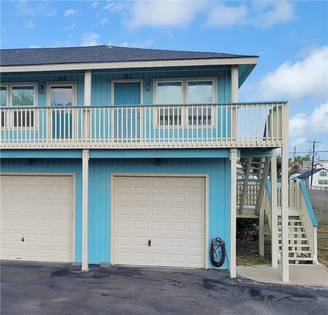 a view of a house with wooden deck
