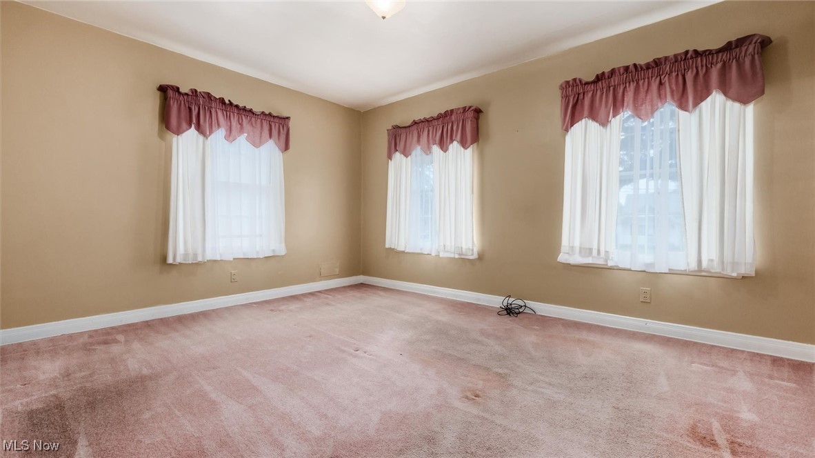 427 Harding Road Zanesville, OH 43701 - Photo 14 of 23 Carpeted spare room featuring baseboards