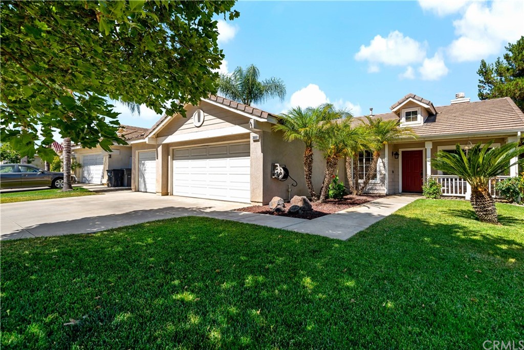 36661 Beech Street Winchester, CA 92596 - Photo 1 of 33 a front view of a house with patio and garden
