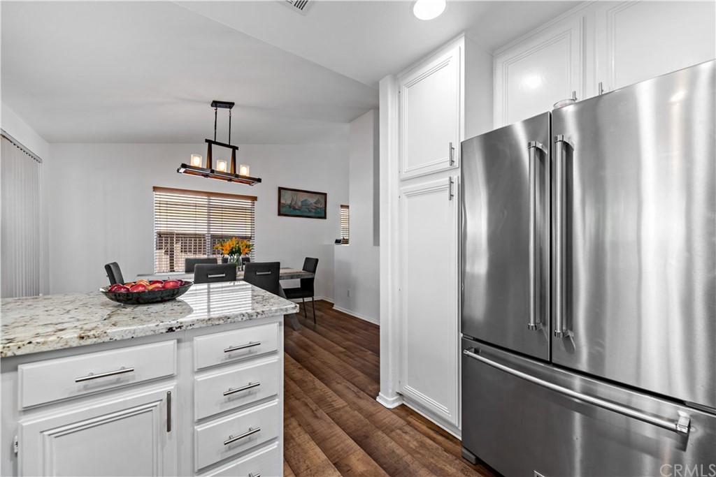 36661 Beech Street Winchester, CA 92596 - Photo 13 of 33 a kitchen with refrigerator a sink and cabinets