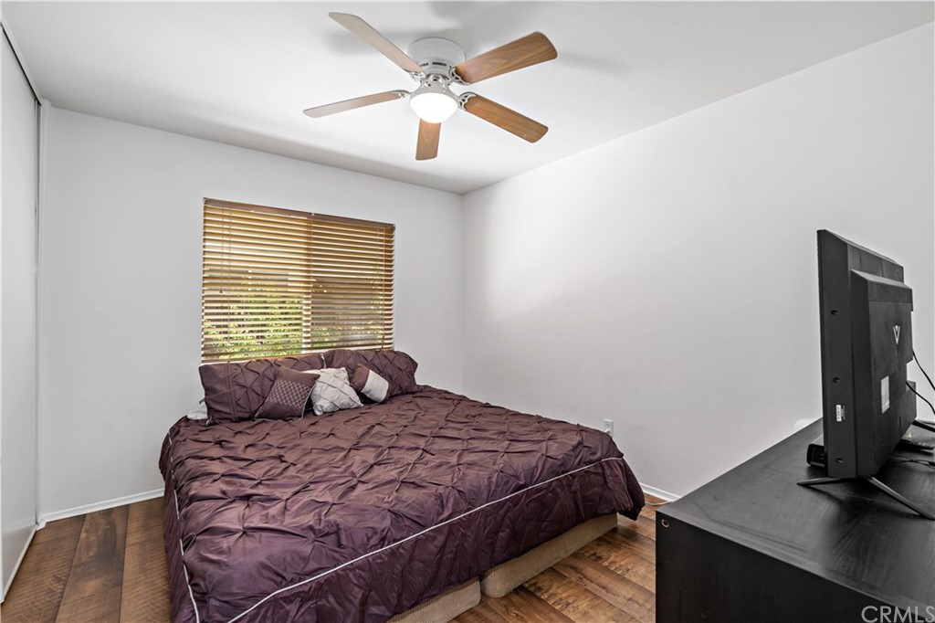 36661 Beech Street Winchester, CA 92596 - Photo 20 of 33 a bedroom with a bed a window and a flat screen tv